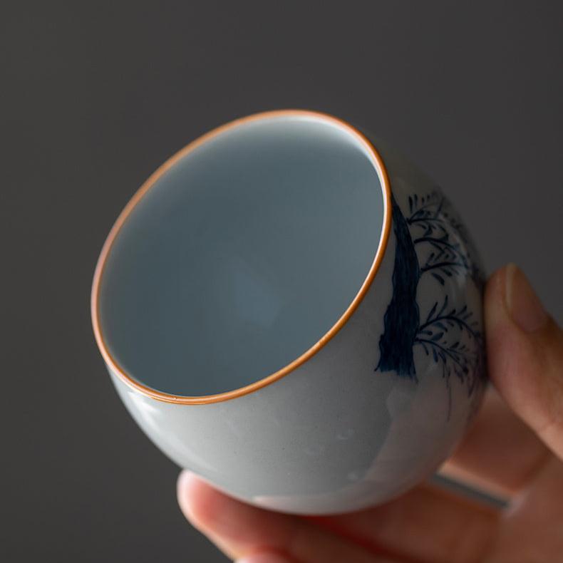 Tazza da tè cinese classica a forma di uovo con smalto blu cobalto in fiore orientale